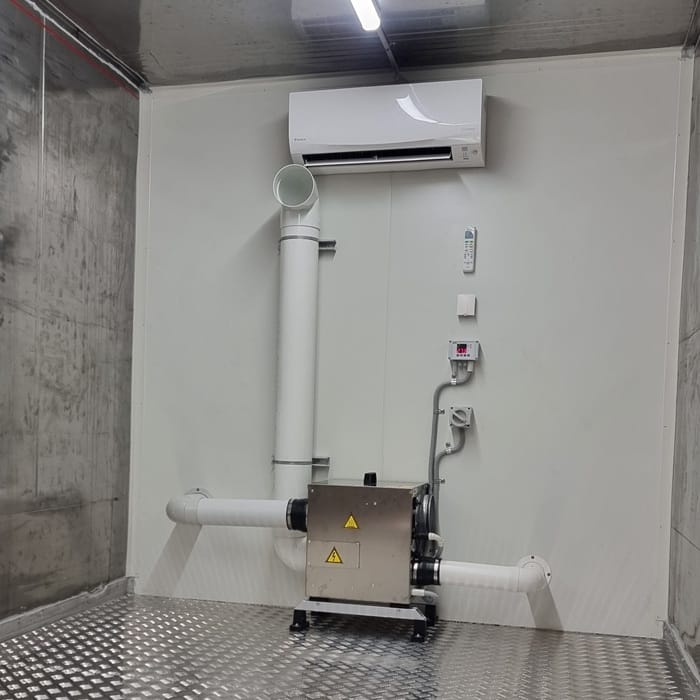 Custom room build for seed storage, using a commercial dehumidifier and air conditioner unit to keep area cool and dry