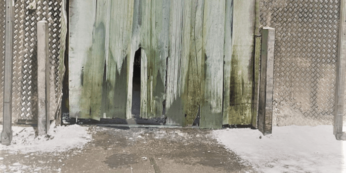 Broken strip curtains inside a meat processing facility